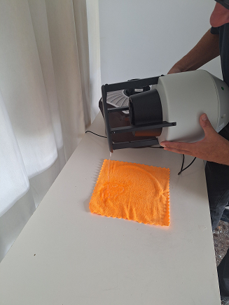 Drain excess solution from the inside of the sun hat